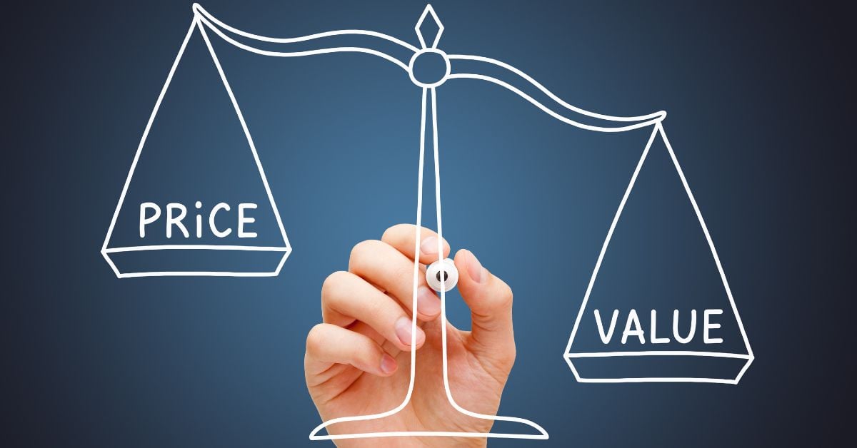A hand holding a white marker draws a scale. The lower side reads "value," and the higher side reads "price."